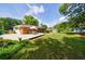 Spacious backyard featuring a dining set on a white deck and lush green lawn at 3060 Wilson Rd, Decatur, GA 30033