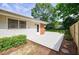 Backyard view of white deck with a side entrance and fenced yard at 3060 Wilson Rd, Decatur, GA 30033