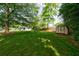 Spacious backyard with lush green grass and a storage shed, perfect for outdoor activities at 3060 Wilson Rd, Decatur, GA 30033