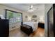 Cozy bedroom with hardwood floors, ceiling fan, and ample natural light at 3060 Wilson Rd, Decatur, GA 30033