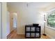 Cozy bedroom featuring hardwood floors and a window with natural light at 3060 Wilson Rd, Decatur, GA 30033