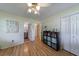 Bright bedroom with hardwood floors and a view into an ensuite bathroom at 3060 Wilson Rd, Decatur, GA 30033