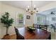 Well-lit dining room with wooden table and view to living area at 3060 Wilson Rd, Decatur, GA 30033