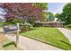 Charming one-story brick home featuring a well-manicured lawn and blue shutters at 3060 Wilson Rd, Decatur, GA 30033