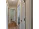 Hallway with hardwood floors, fresh paint, and ample closet space at 3060 Wilson Rd, Decatur, GA 30033