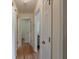 Bright hallway with wood floors and multiple doorways at 3060 Wilson Rd, Decatur, GA 30033