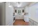 White kitchen with ample counter space and tile flooring at 3060 Wilson Rd, Decatur, GA 30033