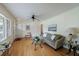 Inviting living room with hardwood floors, neutral paint, ceiling fan, and large sunny window at 3060 Wilson Rd, Decatur, GA 30033