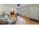 Bright living room featuring hardwood floors, neutral paint, and open floor plan into the dining area at 3060 Wilson Rd, Decatur, GA 30033