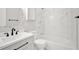 Bright bathroom featuring a vanity with modern fixtures, a sleek mirror, and a shower/tub with stylish tiling at 4129 Pepperdine Dr, Decatur, GA 30034