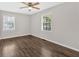 Bedroom featuring hardwood floors, a ceiling fan, and a windows offering plenty of natural light at 4129 Pepperdine Dr, Decatur, GA 30034