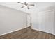 Bright bedroom with hardwood floors, a ceiling fan, and a closet offering plenty of storage at 4129 Pepperdine Dr, Decatur, GA 30034