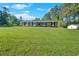 Inviting brick home with a lush front lawn and tasteful landscaping, complemented by black window shutters at 4129 Pepperdine Dr, Decatur, GA 30034