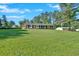 Well-manicured lawn leading up to a classic brick home with black shutters and a welcoming entrance at 4129 Pepperdine Dr, Decatur, GA 30034