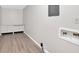 Bright laundry room with laminate flooring and a clean, functional design at 4129 Pepperdine Dr, Decatur, GA 30034