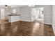 Hardwood flooring throughout the living and dining room area with modern lighting at 4129 Pepperdine Dr, Decatur, GA 30034