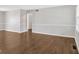 Bright, spacious living room featuring hardwood floors and a classic wainscoting detail at 4129 Pepperdine Dr, Decatur, GA 30034