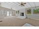 Bright sunroom features a white-painted fireplace and plenty of natural light, perfect for relaxing or entertaining at 4129 Pepperdine Dr, Decatur, GA 30034