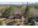 Aerial view of the home showcasing the well-maintained yard, mature trees, and location near the city at 725 Glengary Ne Way, Atlanta, GA 30342