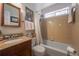 Cozy bathroom with granite vanity, tub, and shower provides a functional and relaxing space at 725 Glengary Ne Way, Atlanta, GA 30342