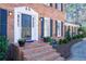 The front entrance shows a traditional brick staircase leading to a black front door with white trim at 725 Glengary Ne Way, Atlanta, GA 30342