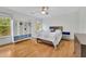 Comfortable bedroom with natural light and minimalist decor at 1025 Saint Marks Walk, Suwanee, GA 30024