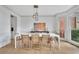 Elegant dining room featuring ample natural light, stylish lighting, and views of the yard at 1025 Saint Marks Walk, Suwanee, GA 30024
