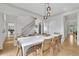 Bright dining room showcasing a large dining table, elegant columns, and stylish decor at 1025 Saint Marks Walk, Suwanee, GA 30024
