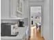 Bright white kitchen with granite counters, stainless appliances, and adjacent dining area at 1025 Saint Marks Walk, Suwanee, GA 30024