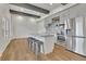Modern kitchen with stainless steel appliances, an island and gray cabinets at 1025 Saint Marks Walk, Suwanee, GA 30024