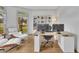 Bright home office with a large window, hardwood floors, modern furniture, and built-in shelving at 1025 Saint Marks Walk, Suwanee, GA 30024