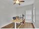 Home office features a modern desk, rolling chair, wood floors and natural light at 1025 Saint Marks Walk, Suwanee, GA 30024