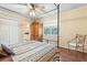 Bedroom with a canopy bed and wooden armoire and ensuite bathroom for ultimate convenience at 3147 Buford Ne Hwy # 2, Atlanta, GA 30329
