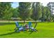 Outdoor seating area with Adirondack chairs around a fire pit for relaxing and enjoying the community's green space at 3147 Buford Ne Hwy # 2, Atlanta, GA 30329