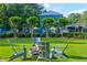 Community green space with Adirondack chairs, a wood-burning fire pit, and professional landscaping at 3147 Buford Ne Hwy # 2, Atlanta, GA 30329