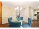 Well-lit dining room featuring a glass table, seating for four, and an elegant chandelier at 3147 Buford Ne Hwy # 2, Atlanta, GA 30329