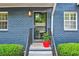 Townhouse entryway with blue painted brick and a welcoming front door with steps at 3147 Buford Ne Hwy # 2, Atlanta, GA 30329