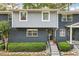Charming townhouse with gray and blue brick and manicured landscaping and front steps at 3147 Buford Ne Hwy # 2, Atlanta, GA 30329