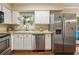 Well-lit kitchen featuring stainless steel appliances, white cabinets, and granite countertops at 3147 Buford Ne Hwy # 2, Atlanta, GA 30329