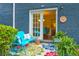Cozy outdoor patio with seating, plants, and a view into the dining area through sliding glass doors at 3147 Buford Ne Hwy # 2, Atlanta, GA 30329