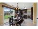 Inviting kitchen features stainless steel appliances, dark wood cabinetry, and large sliding glass doors to the backyard at 3235 Northcliff Dr, Suwanee, GA 30024