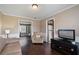 Cozy room with a leather chair and sofa, perfect for relaxation at 3235 Northcliff Dr, Suwanee, GA 30024
