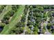 Aerial shot showcases the community's golf course, lush greenery, and beautiful homes at 5567 Stapleton Dr, Dunwoody, GA 30338