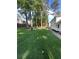 View of large grassy backyard with mature trees and privacy fence at 5567 Stapleton Dr, Dunwoody, GA 30338