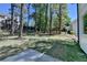Beautiful backyard with mature trees and a concrete patio at 5567 Stapleton Dr, Dunwoody, GA 30338