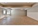 Spacious finished basement featuring tile floors, neutral paint, and backyard access at 5567 Stapleton Dr, Dunwoody, GA 30338