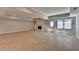 View of finished basement with fireplace, tile flooring, and neutral paint at 5567 Stapleton Dr, Dunwoody, GA 30338