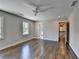 Spacious bedroom with hardwood floors, a ceiling fan, and plenty of natural light at 5567 Stapleton Dr, Dunwoody, GA 30338