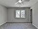 A serene bedroom with a ceiling fan, window, and neutral paint at 5567 Stapleton Dr, Dunwoody, GA 30338