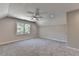 Bright, carpeted bedroom with recessed lighting and a large window at 5567 Stapleton Dr, Dunwoody, GA 30338